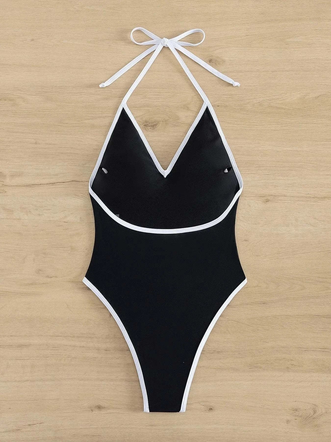 Black Deep-V backless swimsuit showcasing sleek and sculpted design for confident wear